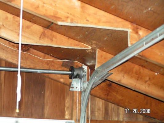 Someone wanted an overhead door in their short garage. But they made the roof prone to collapse under snow load by cutting th...