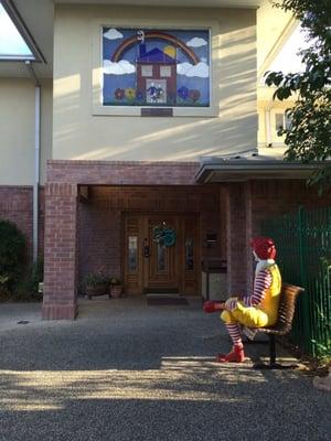 Front entrance and great stained-glass window and the big guy himself, chilling on bench outside. :)