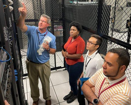 Leon explains various aspects of our data center to UCF students shadowing for the day.