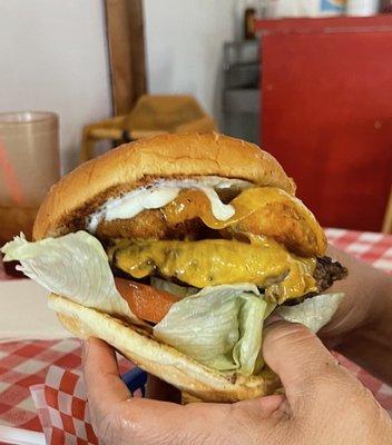 Jalapeño bomber burger.. has meat, cheese, jalapeño poppers, lettuce, tomato pickles and mayonnaise and mustard. It was awesome