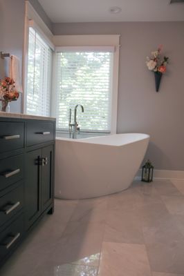 Custom Master Bath Remodel. Blue Forest Marble tile, free-standing soaker tub and custom craftsman trim and moldings.