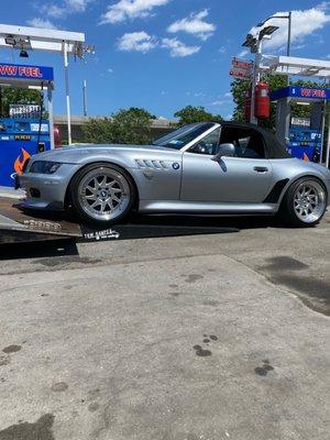 My car being towed with race ramps to keep my bumper from getting damaged while loading