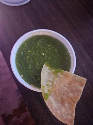 Stale chips and some deep green weird looking fake salsa.