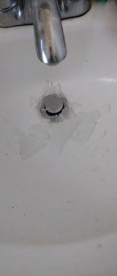 Glass in sink from fixture