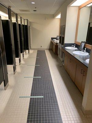 Cabinet door missing, soap all over sinks, locked stall doors.