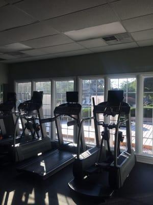 2 nice treadmills and 2 ellipticals facing the pool. Great in the afternoon.