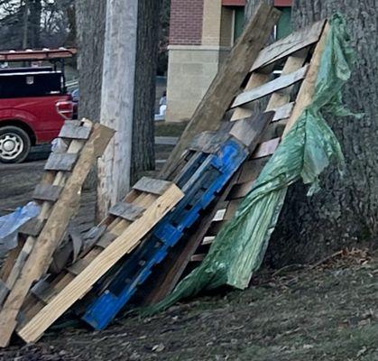 Dirty pallets in front of school