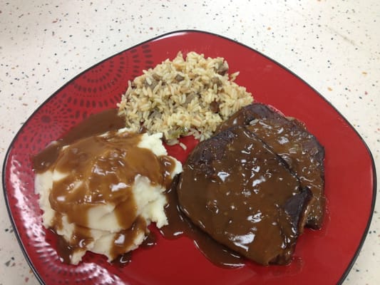 Pot roast, mashed potatoes and gravy, and fresh-made cajun rice.