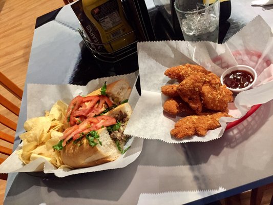 Cheesesteak and potato chip crusted chicken tenders. Great cheesesteak but the ketchup offered on the table has a sour flavor.