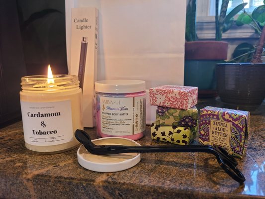 My bounty: a candle, chargeable lighter, wick-trimmer, mermaid body butter and scented soaps.