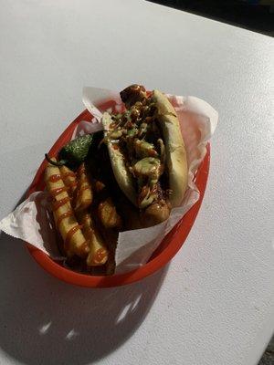 Our famous bacon wrapped hotdogs with a chile toriado and our tasty grilled onions and our seasonal guacamole sauce