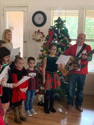 lovely little carolers spreading holiday cheer by visiting our patients along with our chaplain and volunteers!