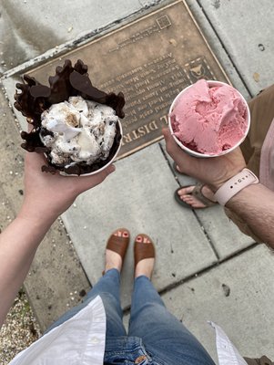 Left: regular size cookie dough yo yo without fudge in a chocolate dipped waffle cone. Right: small strawberry cookie dough in a cup