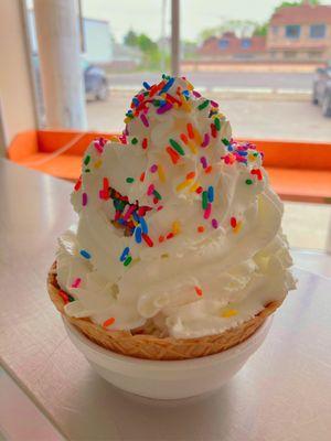 Waffle bowl sundae with whipped cream and sprinkles. Wow!