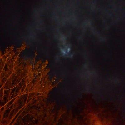 Moon peeking through rain clouds