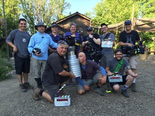 Outsider's crew displaying a Stanley cup built from film cans