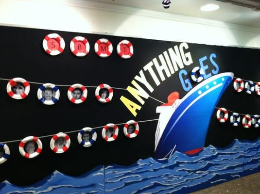 The lobby design for 'Anything Goes'. Life savers frame each cast person's face - so cute!