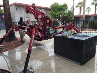 Our special Spyder Crane for hard to reach spots..oh and yes we even work in the rain.