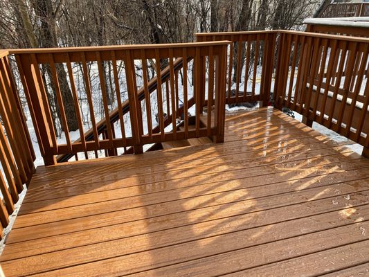 Finished deck, with Trex on floor, top rails, and stairs