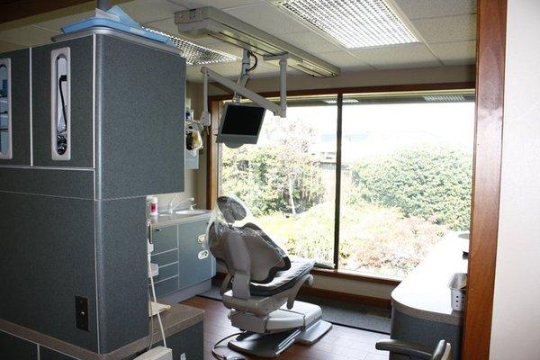 A patient treatment room and chair.