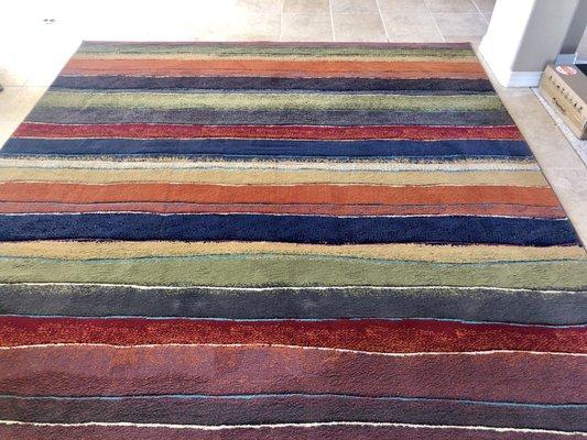 This rug is 14 yrs old. The amount of pet hair they scraped out of it was embarrassing! Look how amazing it came out!