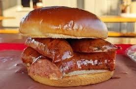 Linked sausage on buttered bun