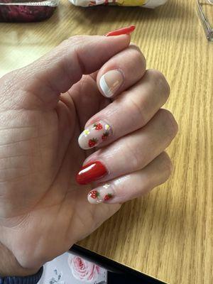 I had some nail stickers I wanted April to use but they didn't work so she painted the strawberries herself.