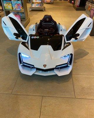 Children Riding Lamborghini white Car