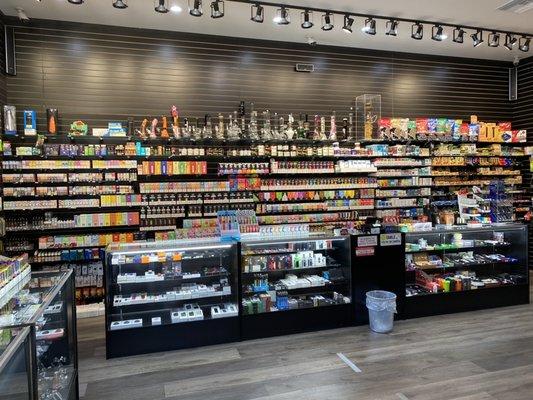 Roupik Smoke Shop Inside View.
 Disposable vapes, vape mods, water pipes, hand pipes, dab pens, and rolling papers.