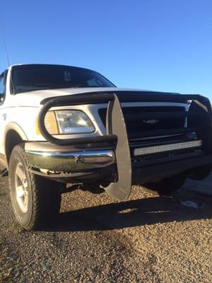 Head on, broken valence, bumper, grille and frame damage.