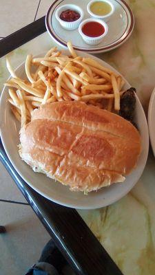 Al Pastor Torta and fries at El Charro. Torta roll was light and fresh. Meat was diced too small and not as flavorful as it could have been.