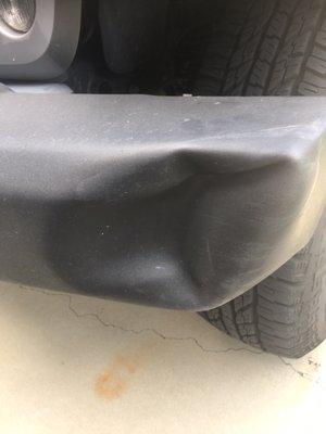 Dented bumper on Jeep Wrangler