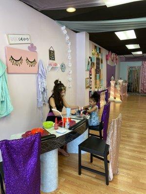 Getting a manicure (looking toward the back)