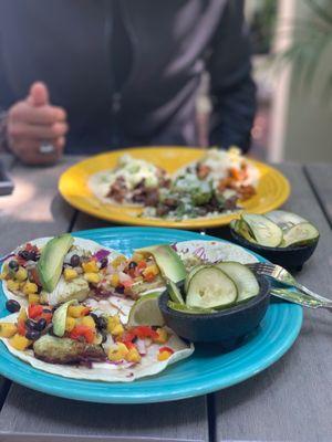 Flour tortillas with fish and mango salad. Rear dish is three meats on corn tortilla.