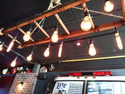 Light over our table,  cool pendants suspended from a ladder.