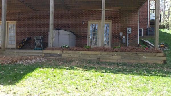 Planter boxes installed along with retaining walls and azaleas with a ninety day warranty bought and installed by Jacobs Land...