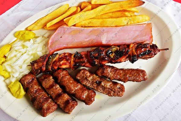 Cevapi with a skewer of kabob and a big chunk of ham.