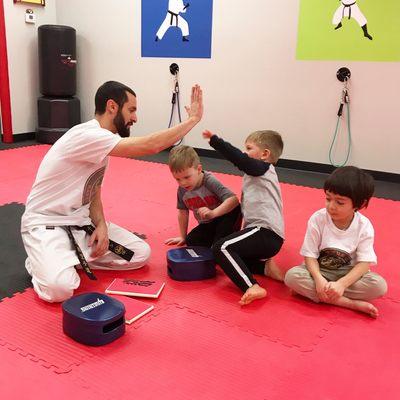 Little Ninjas celebrate after breaking boards