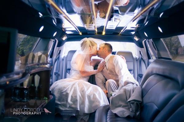 A kiss in the limo after a Rome, Georgia wedding.