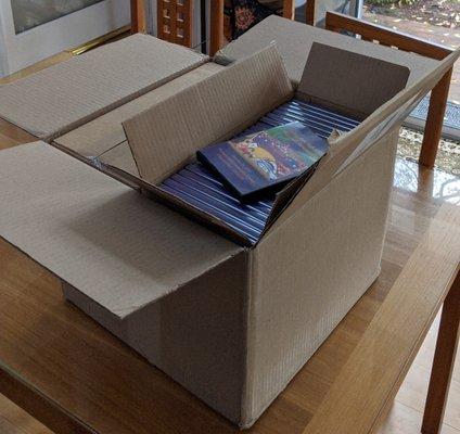 Big box with 4 smaller boxes of 25 DVDs each