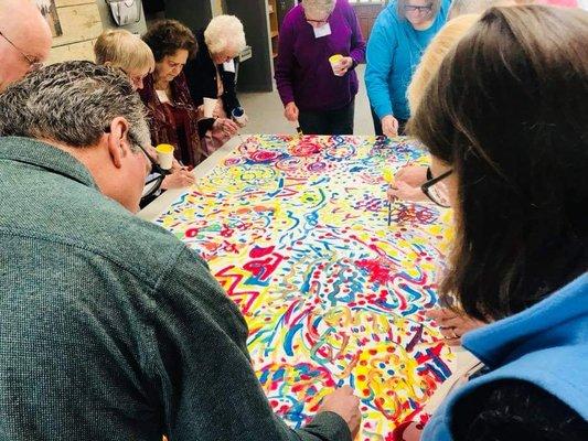 Building community while painting at a mini-retreat.