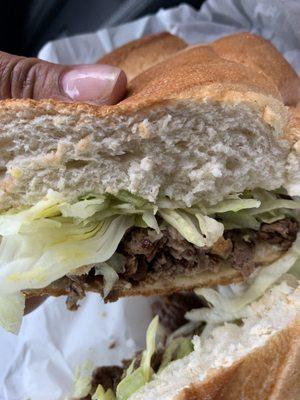 Bifstec encebollao" ( steak sandwich w/ onions)