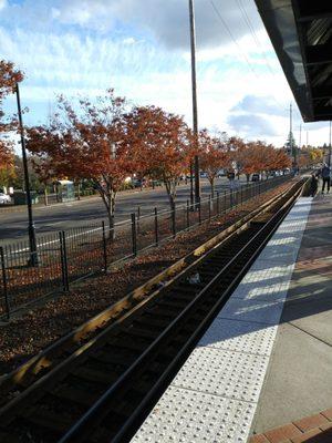 Train tracks on a sunny afternoon.