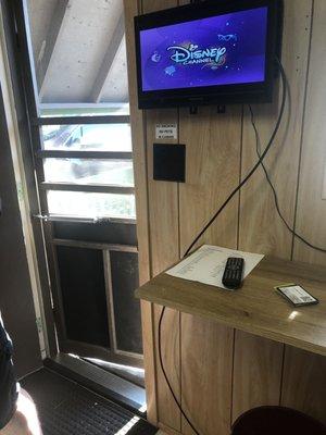 Small cable TV and counter in camping cabin