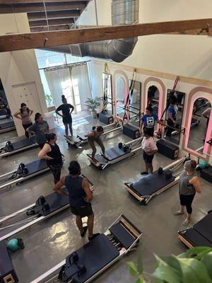 Group reformer class, with Yasmina demonstrating an exercise