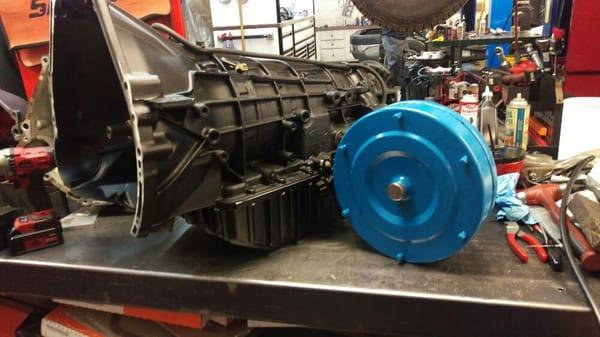 4R100 transmission built with upgrades. Shown with a billet face multi-disc torque converter.