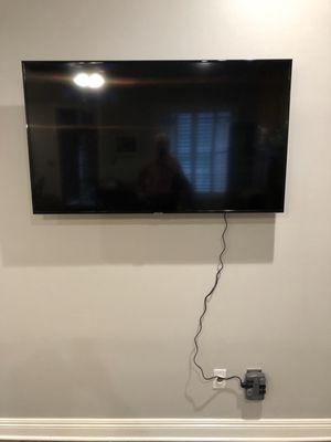 You've got to be kidding! Best Buy installed our TV with the extension cord hanging down the wall.