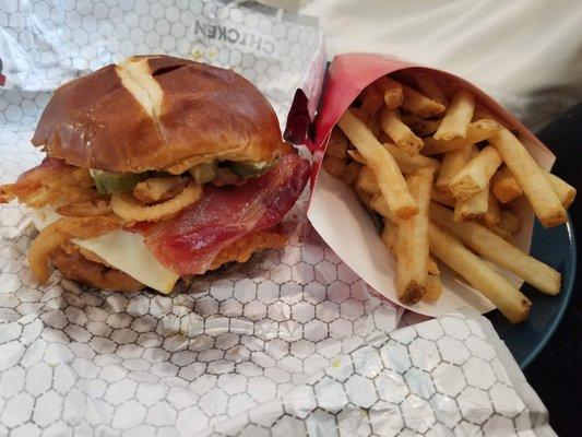 Pub cheese chicken sandwich on pretzel bun and fries