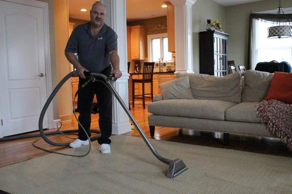 owner cleaning a carpet