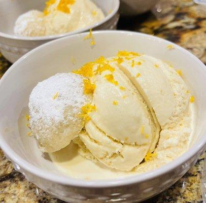 Homemade Meyer lemon and honey ice cream with lavender shortbread cookie.